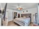 Bedroom with wood-look flooring, shiplap accent wall, closet and ceiling fan at 5316 Forestbrook E Dr, Lakeland, FL 33811