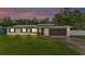 Charming single-story home with a well-maintained lawn, a two car garage, and solar panels on the roof at 5316 Forestbrook E Dr, Lakeland, FL 33811