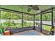 Screened patio with string lights overlooking a spacious backyard, perfect for relaxing and entertaining at 5316 Forestbrook E Dr, Lakeland, FL 33811