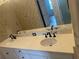 Bathroom with a long vanity, double sinks, and large mirror for daily routines at 5480 Summerland Hills Dr, Lakeland, FL 33812