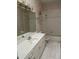 Well-lit bathroom featuring a vanity with storage and a shower-tub combination at 5480 Summerland Hills Dr, Lakeland, FL 33812