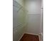 Walk-in closet providing ample storage space with wire shelving and hardwood floors at 5480 Summerland Hills Dr, Lakeland, FL 33812