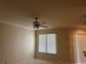 Light-filled living area with tile flooring, a ceiling fan, and large window providing a welcoming atmosphere at 5480 Summerland Hills Dr, Lakeland, FL 33812