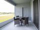 Comfortable outdoor patio seating area, perfect for enjoying the view of the lake and natural light at 561 Silver Course Run, Ocala, FL 34472