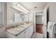 Bathroom with double sinks, granite countertop and stylish fixtures with an adjoined bedroom at 5619 Stratford Ln, Lakeland, FL 33813