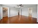 Spacious bedroom with wood floors, neutral walls, ensuite bath and a walk-in closet at 5619 Stratford Ln, Lakeland, FL 33813