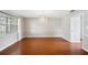 Dining room with wood floors and modern chandelier lighting at 5619 Stratford Ln, Lakeland, FL 33813