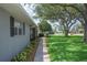 Attractive one-story home with manicured landscaping, a sidewalk leading to the front door, and mature shade trees at 5619 Stratford Ln, Lakeland, FL 33813