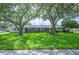 Charming one-story home with a well-maintained lawn and mature shade trees at 5619 Stratford Ln, Lakeland, FL 33813