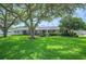 Inviting single-story home with well-maintained lawn and beautiful, mature trees at 5619 Stratford Ln, Lakeland, FL 33813