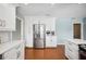 Updated kitchen with new stainless refrigerator and ample counter space at 5619 Stratford Ln, Lakeland, FL 33813