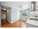 Bright kitchen features wood floors, white cabinets, and stainless steel range hood at 5619 Stratford Ln, Lakeland, FL 33813