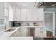 Bright white kitchen features stainless appliances and granite counters at 5619 Stratford Ln, Lakeland, FL 33813