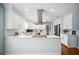 Open kitchen features stainless appliances, white cabinetry, and granite countertops at 5619 Stratford Ln, Lakeland, FL 33813