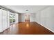 Bright and airy living room featuring hardwood floors and a large bay window at 5619 Stratford Ln, Lakeland, FL 33813