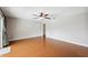 An airy living room featuring hardwood floors, neutral walls and a ceiling fan at 5619 Stratford Ln, Lakeland, FL 33813