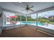 Cozy screened-in porch overlooking a pool, ideal for outdoor relaxation and entertainment at 5619 Stratford Ln, Lakeland, FL 33813