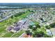 Aerial shot of house and community amenities including pool and golf course at 5857 Macaw Pl, Lakeland, FL 33809
