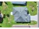 Overhead view of the house showing the roof and manicured lawn in a suburban neighborhood at 5857 Macaw Pl, Lakeland, FL 33809