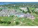 Wide aerial view showcasing the house location within the community near a golf course at 5857 Macaw Pl, Lakeland, FL 33809