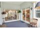 A patio with sliding glass doors leading to the dining room and kitchen areas at 5857 Macaw Pl, Lakeland, FL 33809