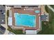 Aerial view of community pool, hot tub, lounge chairs and shaded area at 6001 Condor Dr, Lakeland, FL 33809