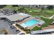 Aerial view of community clubhouse, pool, parking and golf course at 6001 Condor Dr, Lakeland, FL 33809