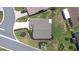 Overhead view of a property with well-maintained landscaping, a driveway, and a serene setting at 6001 Condor Dr, Lakeland, FL 33809