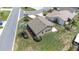 Aerial view of home highlighting its landscaping and manicured lawn in a peaceful neighborhood at 6001 Condor Dr, Lakeland, FL 33809