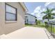 Covered porch with metal railing and view of adjacent homes and landscape at 6001 Condor Dr, Lakeland, FL 33809