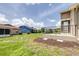 Spacious backyard view of the adjacent homes in the community at 6001 Condor Dr, Lakeland, FL 33809