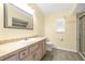 Bathroom with a granite sink, vanity, and a large mirror at 6001 Condor Dr, Lakeland, FL 33809