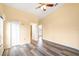 Bedroom featuring vaulted ceilings, ceiling fan, and spacious closet for ample storage at 6001 Condor Dr, Lakeland, FL 33809