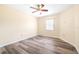 Bedroom with a ceiling fan, hardwood floors and a window at 6001 Condor Dr, Lakeland, FL 33809