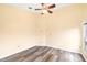 A cozy bedroom featuring hardwood floors and a ceiling fan at 6001 Condor Dr, Lakeland, FL 33809