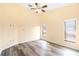 Spacious bedroom with hardwood floors, large windows, and high ceilings at 6001 Condor Dr, Lakeland, FL 33809