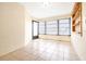 Bonus room with tile flooring, built-in shelving, and natural light at 6001 Condor Dr, Lakeland, FL 33809