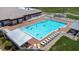 Community pool with lounge chairs around an inviting and clean pool on a sunny day at 6001 Condor Dr, Lakeland, FL 33809