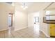 Open dining area with tile flooring adjacent to the kitchen, offering a seamless flow at 6001 Condor Dr, Lakeland, FL 33809