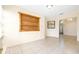 A naturally lit living room with tile flooring and unique built-in wooden shelving at 6001 Condor Dr, Lakeland, FL 33809