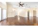 Spacious living room featuring vaulted ceilings, hardwood floors, a fan, and plentiful natural light at 6001 Condor Dr, Lakeland, FL 33809