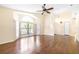 Spacious living room featuring vaulted ceilings, hardwood floors, a fan, and plentiful natural light at 6001 Condor Dr, Lakeland, FL 33809