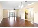 Spacious living room with hardwood floors and large windows, offering plenty of natural light at 6001 Condor Dr, Lakeland, FL 33809