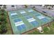 Community pickleball courts featuring six courts, surrounded by a green space and tall green fence at 6001 Condor Dr, Lakeland, FL 33809