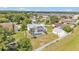 Aerial view of house with screened in pool, fenced yard and garage at 619 Somerset Loop, Auburndale, FL 33823