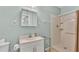 Clean bathroom featuring sink, mirror, and shower with white tile at 619 Somerset Loop, Auburndale, FL 33823