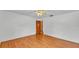 Comfortable bedroom featuring hardwood floors and ceiling fan at 619 Somerset Loop, Auburndale, FL 33823