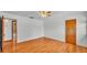 Bedroom with hardwood floors connecting to an adjacent bathroom at 619 Somerset Loop, Auburndale, FL 33823