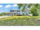 Home exterior with large front lawn during the day at 619 Somerset Loop, Auburndale, FL 33823