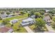 Sprawling home featuring a metal roof, white picket fence, lush landscaping, and an oversized lot at 619 Somerset Loop, Auburndale, FL 33823